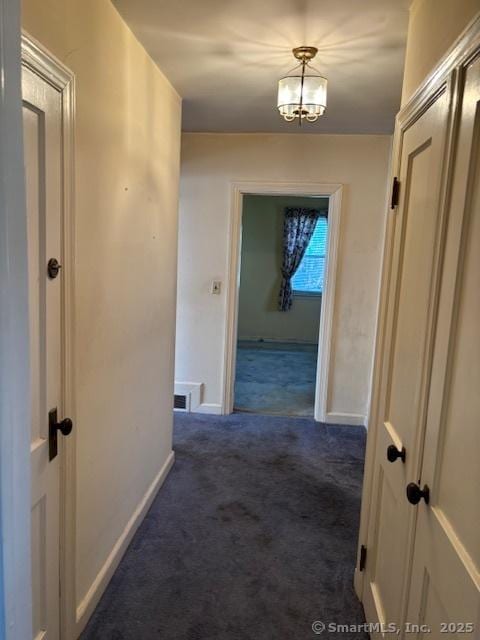 94 Morris St, West Haven, CT 06516 - corridor with visible vents, baseboards, carpet flooring, and a notable chandelier