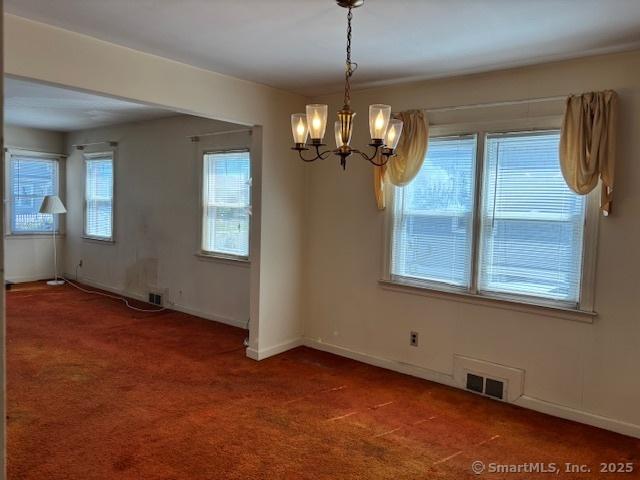 94 Morris St, West Haven, CT 06516 - unfurnished dining area with carpet, visible vents, baseboards, and an inviting chandelier