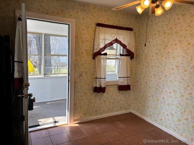 94 Morris St, West Haven, CT 06516 - interior space with dark tile patterned floors, a ceiling fan, and baseboards