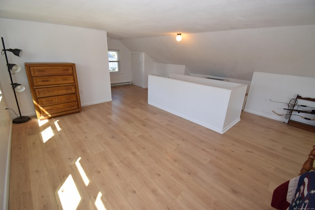 5 Hammock Pkwy, Clinton, CT 06413 - additional living space with lofted ceiling, a baseboard heating unit, light wood-style flooring, and baseboards