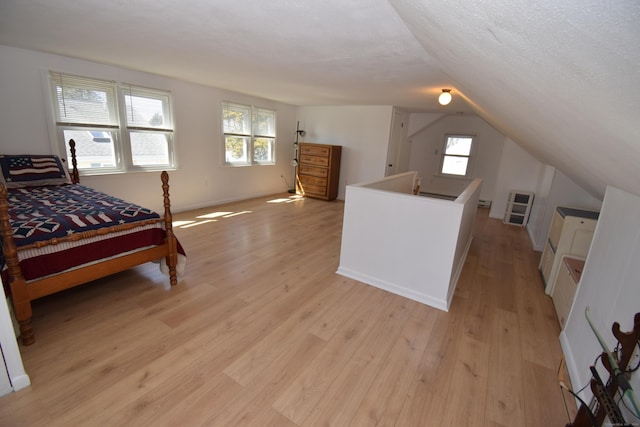 5 Hammock Pkwy, Clinton, CT 06413 - bedroom with light wood-type flooring, lofted ceiling, multiple windows, and baseboards