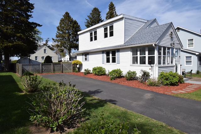 5 Hammock Pkwy, Clinton, CT 06413 - view of side of home featuring roof with shingles