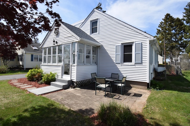 5 Hammock Pkwy, Clinton, CT 06413 - rear view of house with a yard, a sunroom, and a patio