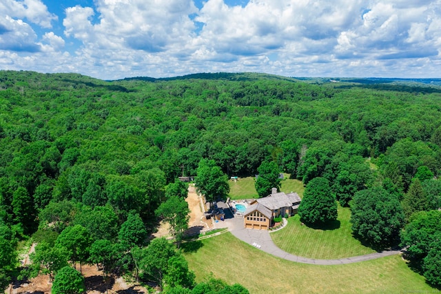 birds eye view of property with a wooded view