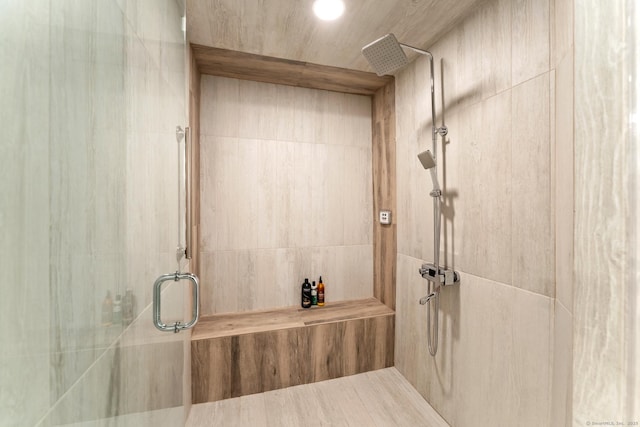 full bathroom featuring a tile shower