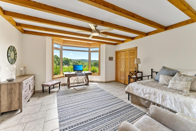 bedroom with baseboards, light tile patterned flooring, and beamed ceiling