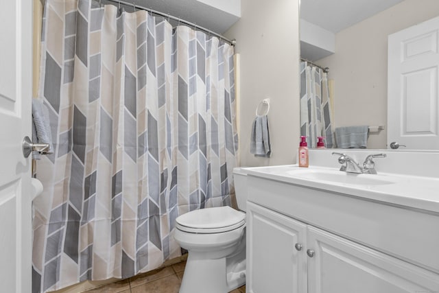 full bath featuring toilet, tile patterned floors, vanity, and a shower with shower curtain