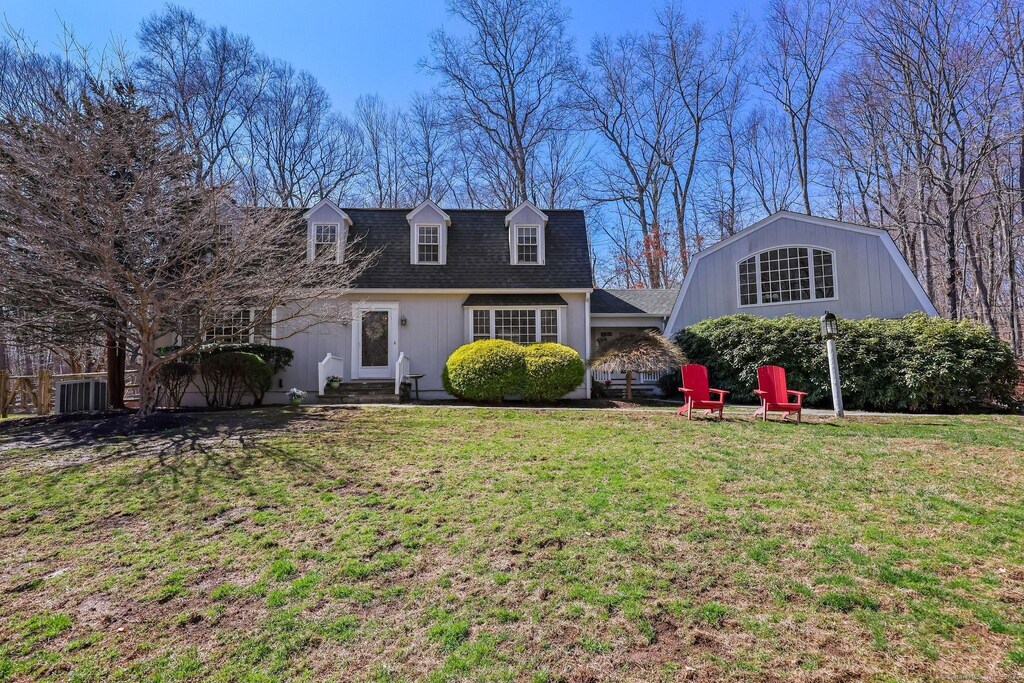 268 Mountain Rd, Wilton, CT 06897 - cape cod house with entry steps, a front lawn, and a shingled roof