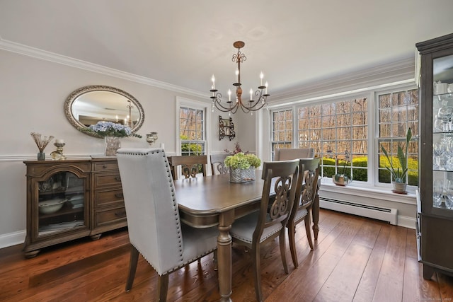 dining space featuring a notable chandelier, baseboard heating, ornamental molding, and dark wood-style floors