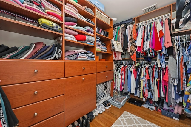 spacious closet with wood finished floors and visible vents