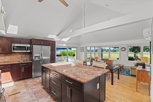 231 Pawson Rd, Branford, CT 06405 - kitchen with stainless steel appliances, open floor plan, high vaulted ceiling, tasteful backsplash, and light stone countertops