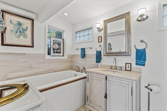 231 Pawson Rd, Branford, CT 06405 - full bath featuring vanity, a garden tub, and beam ceiling