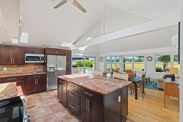 231 Pawson Rd, Branford, CT 06405 - kitchen with appliances with stainless steel finishes, healthy amount of natural light, light stone counters, ceiling fan, and high vaulted ceiling