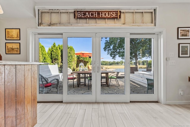 231 Pawson Rd, Branford, CT 06405 - doorway to outside with wood finished floors and baseboards
