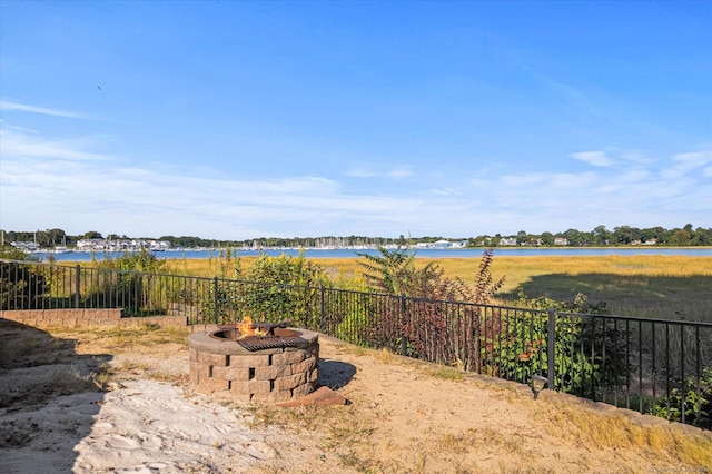 231 Pawson Rd, Branford, CT 06405 - view of yard with a fire pit, fence, and a water view