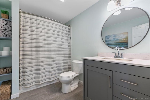 full bathroom with tile patterned flooring, toilet, curtained shower, and vanity