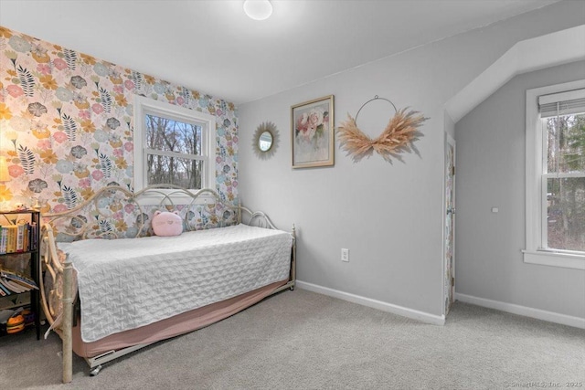 bedroom with carpet and baseboards