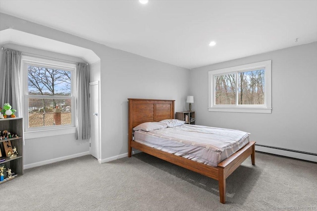 carpeted bedroom featuring recessed lighting, baseboard heating, and baseboards