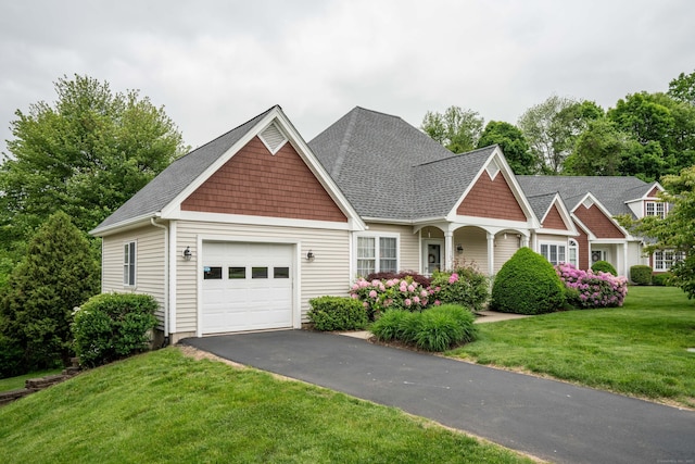 175 Thistle Pond Dr Unit 175, Bloomfield, CT 06002 - view of front of home featuring an attached garage, a front yard, driveway, and a shingled roof