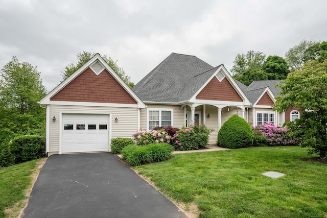 175 Thistle Pond Dr Unit 175, Bloomfield, CT 06002 - craftsman-style home featuring an attached garage, a front yard, driveway, and roof with shingles