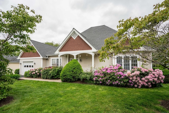 175 Thistle Pond Dr Unit 175, Bloomfield, CT 06002 - view of front of house featuring a garage, a shingled roof, and a front yard