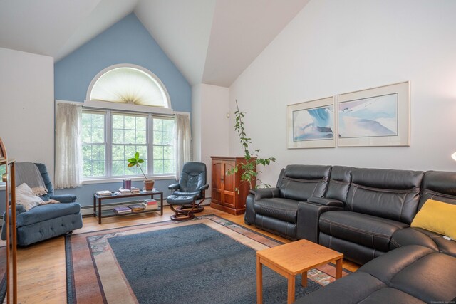 175 Thistle Pond Dr Unit 175, Bloomfield, CT 06002 - living room featuring wood finished floors and high vaulted ceiling
