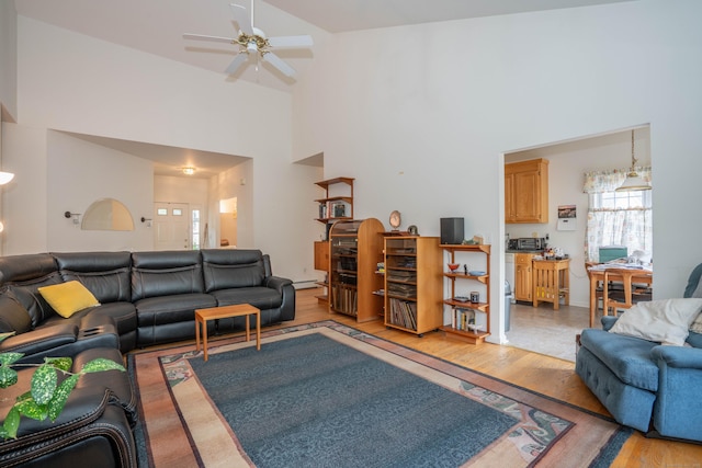 175 Thistle Pond Dr Unit 175, Bloomfield, CT 06002 - living room with light wood-style flooring, a ceiling fan, and a towering ceiling