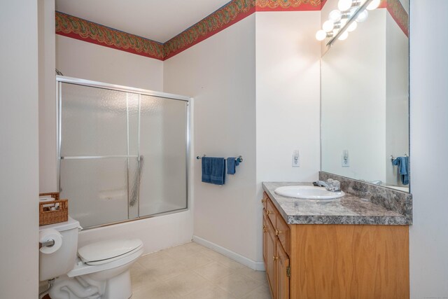 175 Thistle Pond Dr Unit 175, Bloomfield, CT 06002 - full bathroom with toilet, vanity, enclosed tub / shower combo, tile patterned flooring, and baseboards