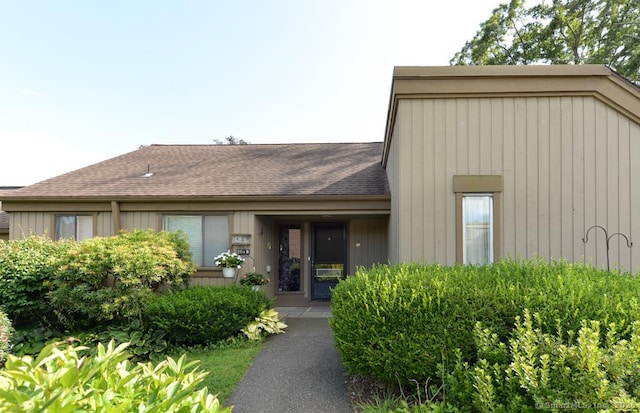 view of front of property with roof with shingles