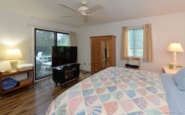 bedroom featuring multiple windows, a ceiling fan, access to exterior, and wood finished floors