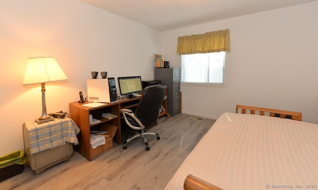 office featuring baseboards and wood finished floors