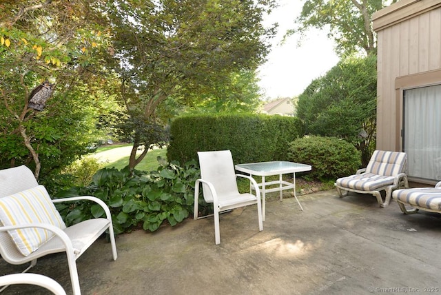 view of patio featuring outdoor dining area