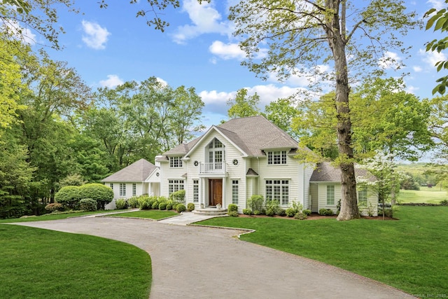 3 Mayflower Ln, Weston, CT 06883 - view of front of home with a front lawn, a shingled roof, and driveway