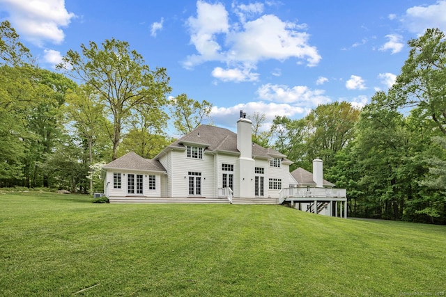 3 Mayflower Ln, Weston, CT 06883 - rear view of property with a shingled roof, a deck, and a lawn