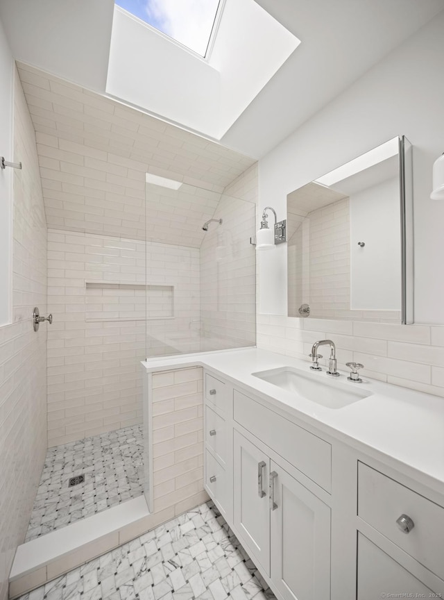 3 Mayflower Ln, Weston, CT 06883 - full bath with vanity, marble finish floor, walk in shower, and a skylight
