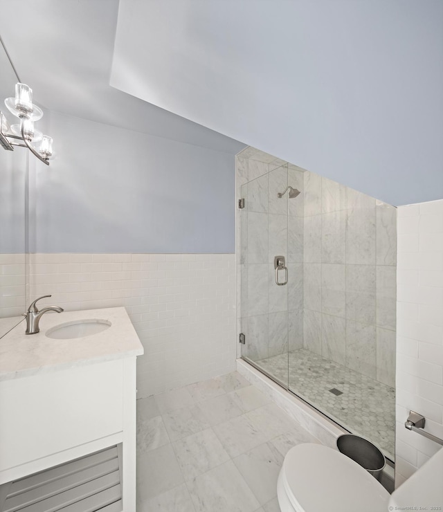 3 Mayflower Ln, Weston, CT 06883 - full bathroom with an inviting chandelier, vanity, wainscoting, tile walls, and a stall shower