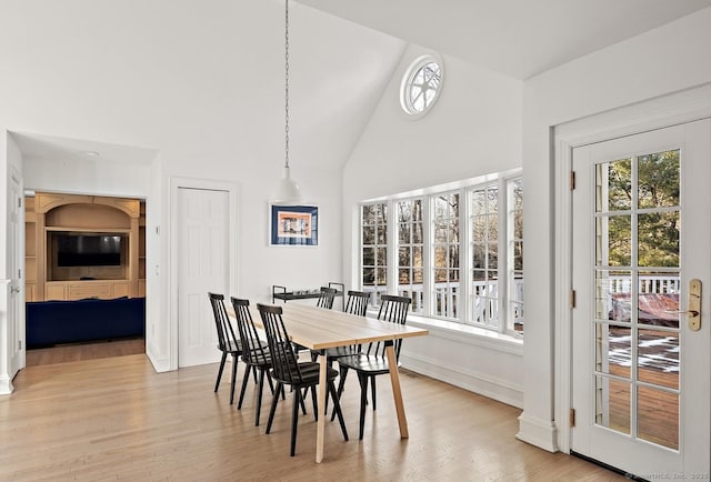 3 Mayflower Ln, Weston, CT 06883 - dining space featuring high vaulted ceiling, light wood-type flooring, and baseboards