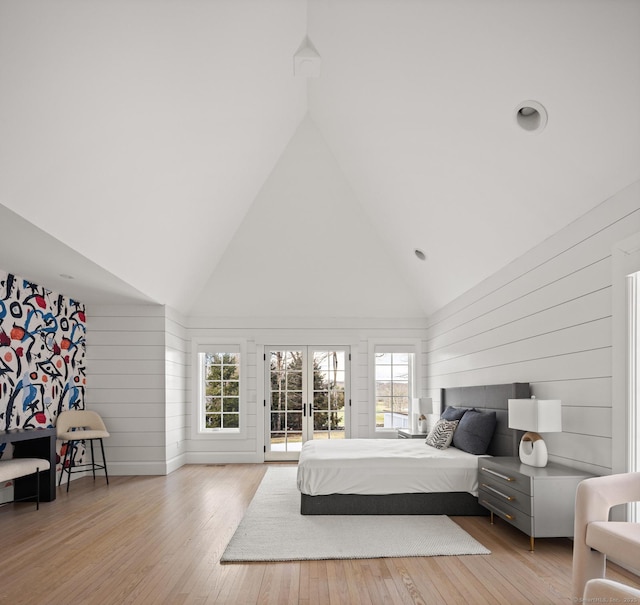 3 Mayflower Ln, Weston, CT 06883 - bedroom featuring french doors, access to exterior, high vaulted ceiling, and wood finished floors