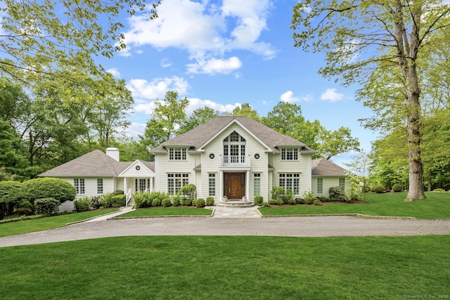 3 Mayflower Ln, Weston, CT 06883 - view of front of property featuring a front yard, a shingled roof, and aphalt driveway