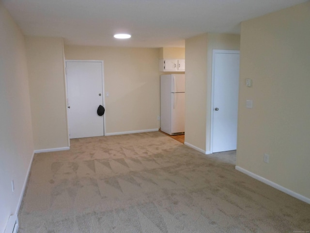 155 Short Beach Rd Unit 206, Stratford, CT 06615 - empty room with baseboard heating and light colored carpet