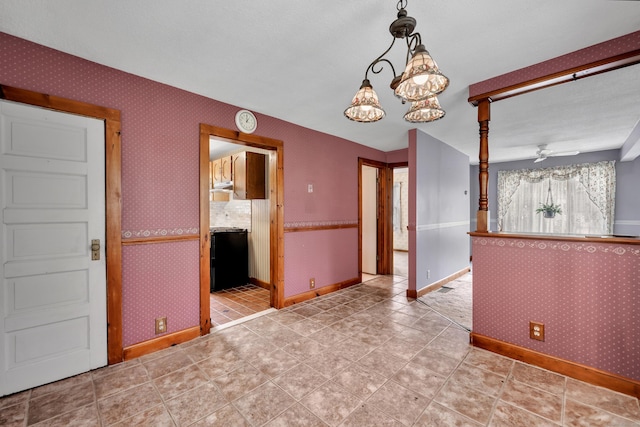 39 Smith St, Bristol, CT 06010 - spare room featuring ceiling fan, a chandelier, wallpapered walls, and baseboards