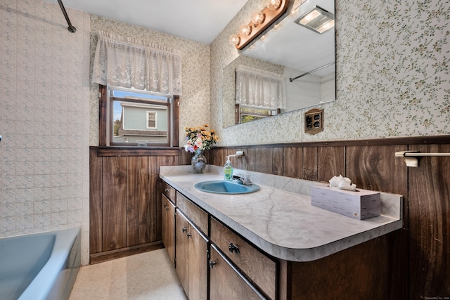 39 Smith St, Bristol, CT 06010 - full bath with wallpapered walls, wainscoting, and vanity