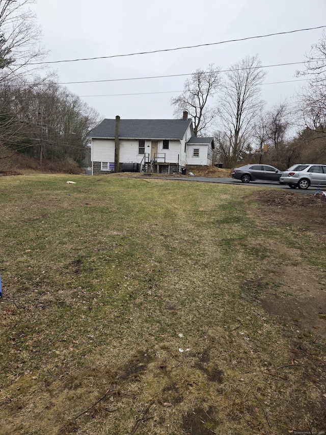 127 Rte 6, Columbia, CT 06237 - view of front of home with a chimney and a front yard