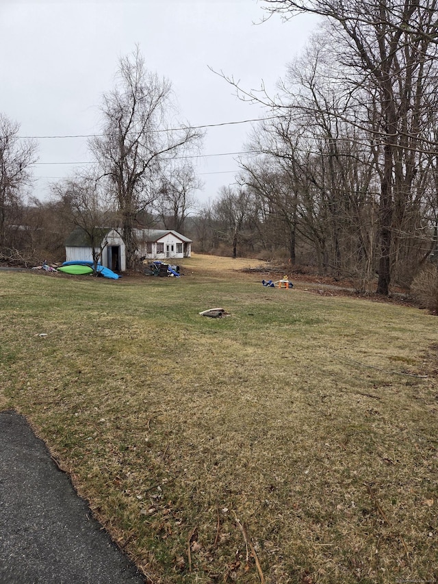 127 Rte 6, Columbia, CT 06237 - view of grassy yard featuring an outdoor structure and a storage unit