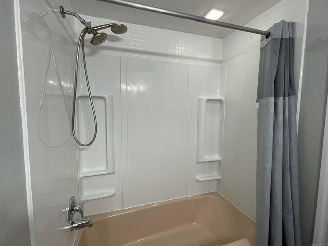 full bath featuring shower / bath combination with curtain