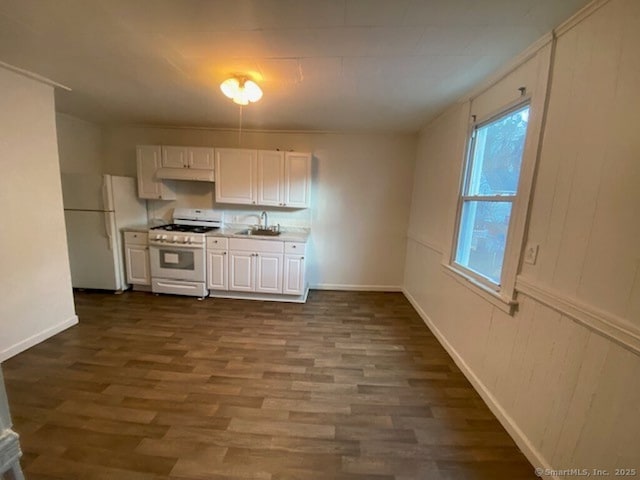 266 Willow St, Waterbury, CT 06710 - kitchen featuring dark wood-style flooring, white cabinets, light countertops, white appliances, and a sink