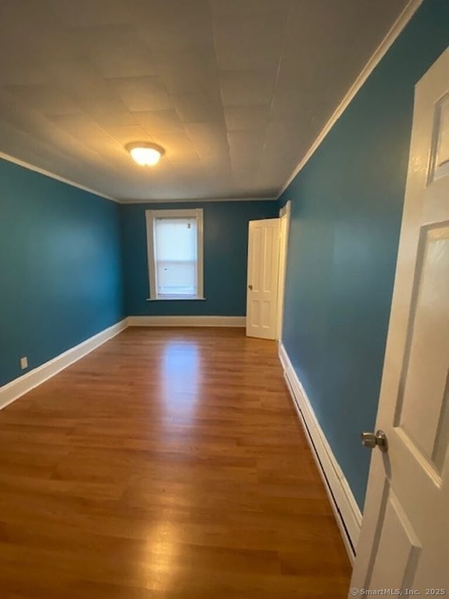 266 Willow St, Waterbury, CT 06710 - empty room featuring crown molding, baseboards, and wood finished floors