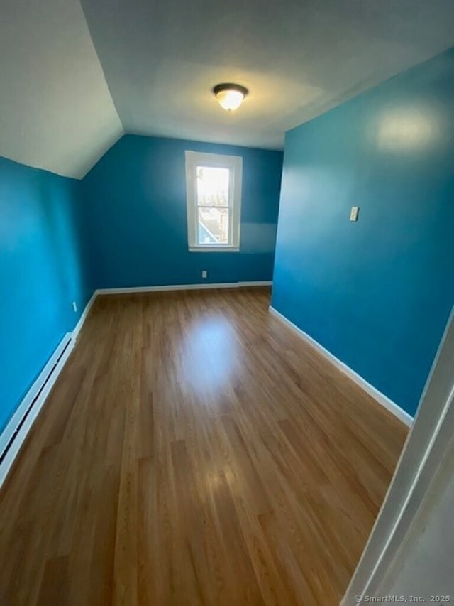 266 Willow St, Waterbury, CT 06710 - additional living space with baseboards, lofted ceiling, wood finished floors, and baseboard heating