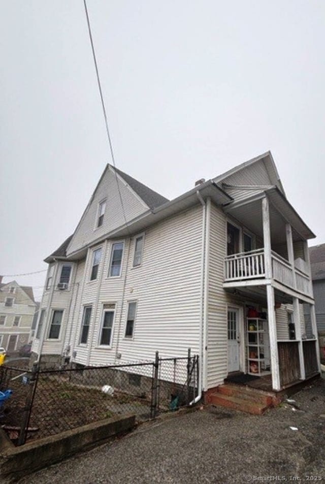 266 Willow St, Waterbury, CT 06710 - exterior space with a balcony, fence, and entry steps