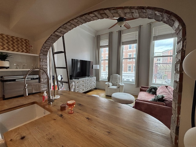 134 Washington St Apt 201, Norwalk, CT 06854 - dining space featuring ceiling fan and arched walkways